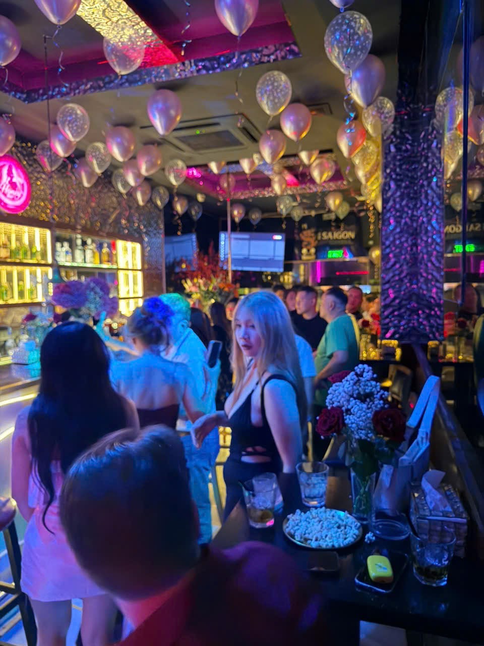 Crowd enjoying the bar at Honey Bar