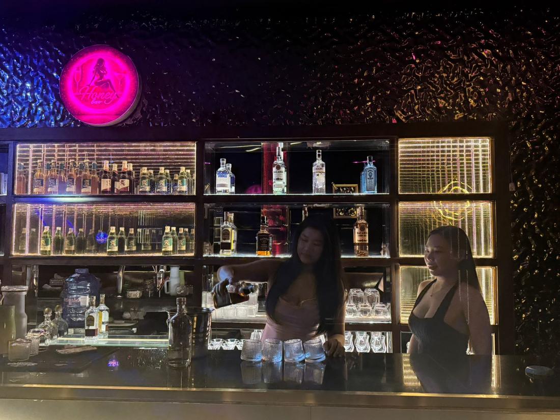 Bartender pouring at Honey Bar