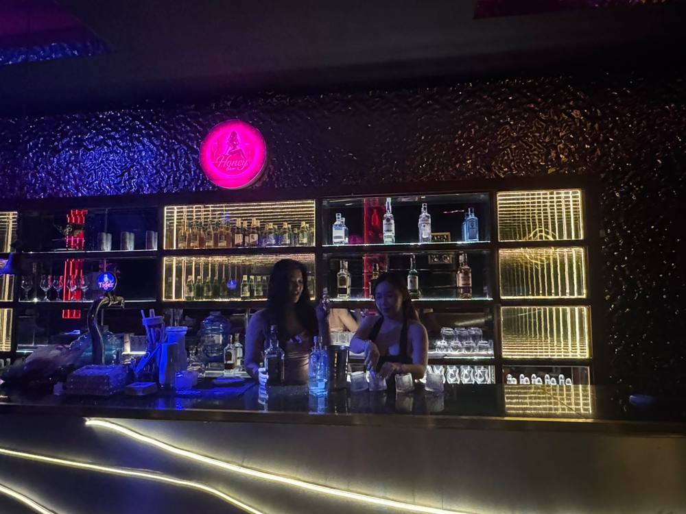 Bar shelves glowing at Honey Bar