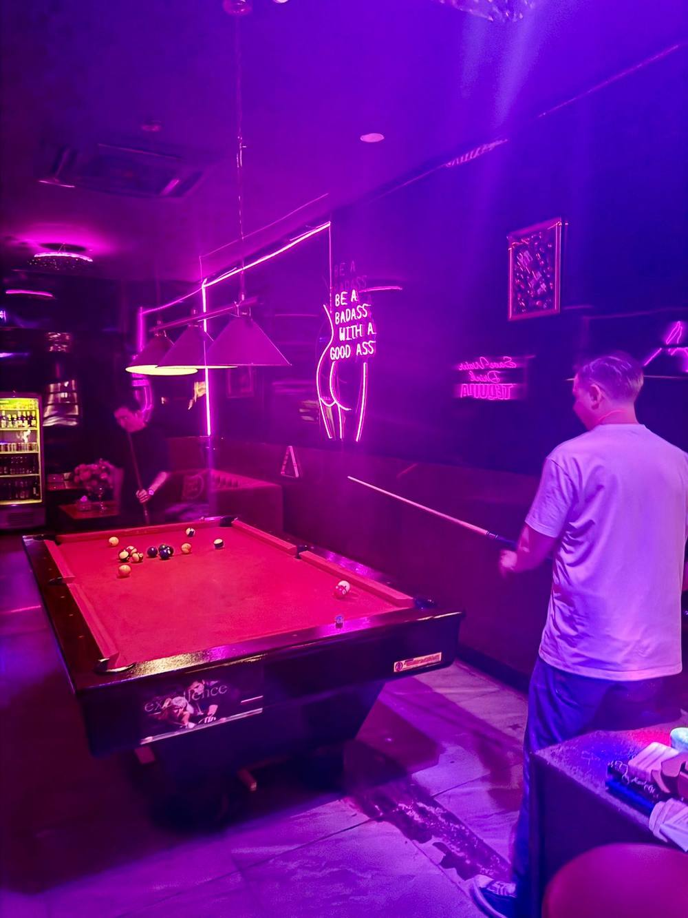 Friends playing pool at Honey Bar Saigon
